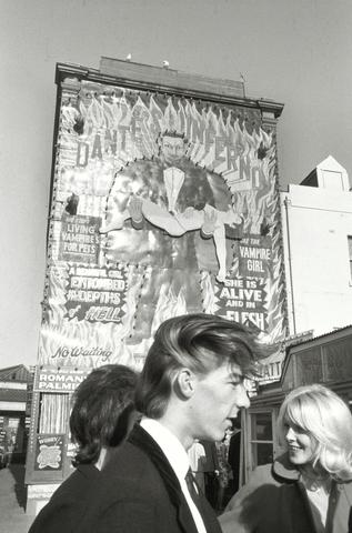 Bruce Davidson Young Couple under Large Dante's Inferno sign