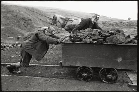Bruce Davidson Coal miners pushing coal filled cart