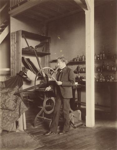 Paul François Arnold Cardon, called "Dornac" Whistler Standing at a Press in His Paris (rue Notre-Dame-des-Champs) Studio