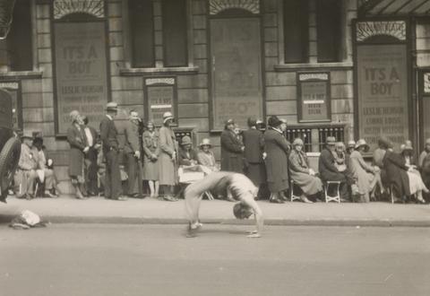 Emil Otto Hoppé Acrobat in front of Theatre Queue, London