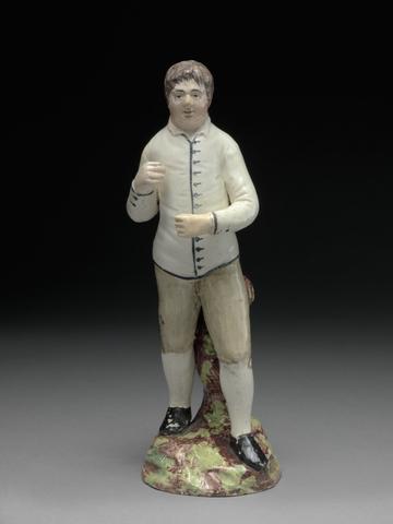 Staffordshire pottery A Pugilist: with a blue edged cream shirt and fawn breeches
