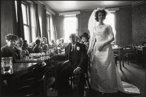 Bride indoors with family