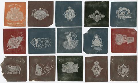  Collection of nine printed specimens of silver foil stamped labels.