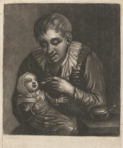 Man Feeding Child
