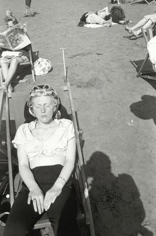 Woman with Curlers Sunning in Beach Chair