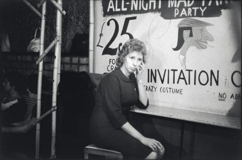Bruce Davidson Somber Girl in Front of 'Invitation'