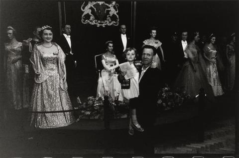 Bruce Davidson Man Holding Child in Front of 'Royalty'
