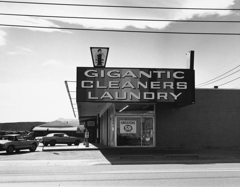 Robert Adams, Untitled (Gigantic Cleaners laundry), 1970–74
