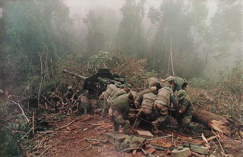 Larry Burrows, Inspecting 122mm artillery piece near Laotian border, from the series: Larry Burrows: Vietnam, The American Intervention 1962 - 1968, 1968, printed 1985