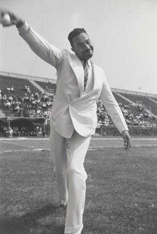 Lucien Aigner, Judge Page, the first black appointed to the City Bench, throws out the first pitch at Randall's Island, New York, 1936