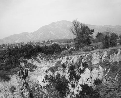 Robert Adams, Eroding edge of a former citrus-growing estate, Highland, California, 1983