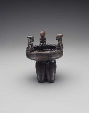 Vessel supported by female kneeling legs, with three figures seated on the rim, 19th century