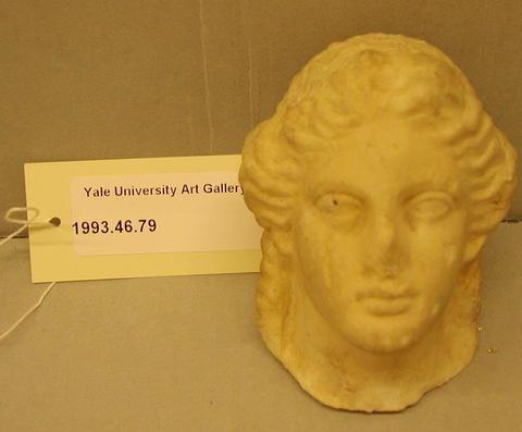 Unknown Roman, Small head of Dionysos (or Apollo?) from a figurine, 1st century A.D.